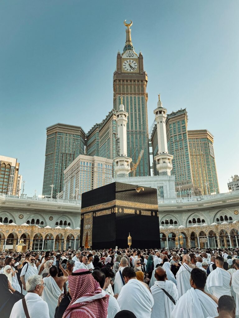 pexels-photo-32906507-32906507 A large crowd of pilgrims gathered around the Kaaba with the iconic clock tower in Makkah, Saudi Arabia.